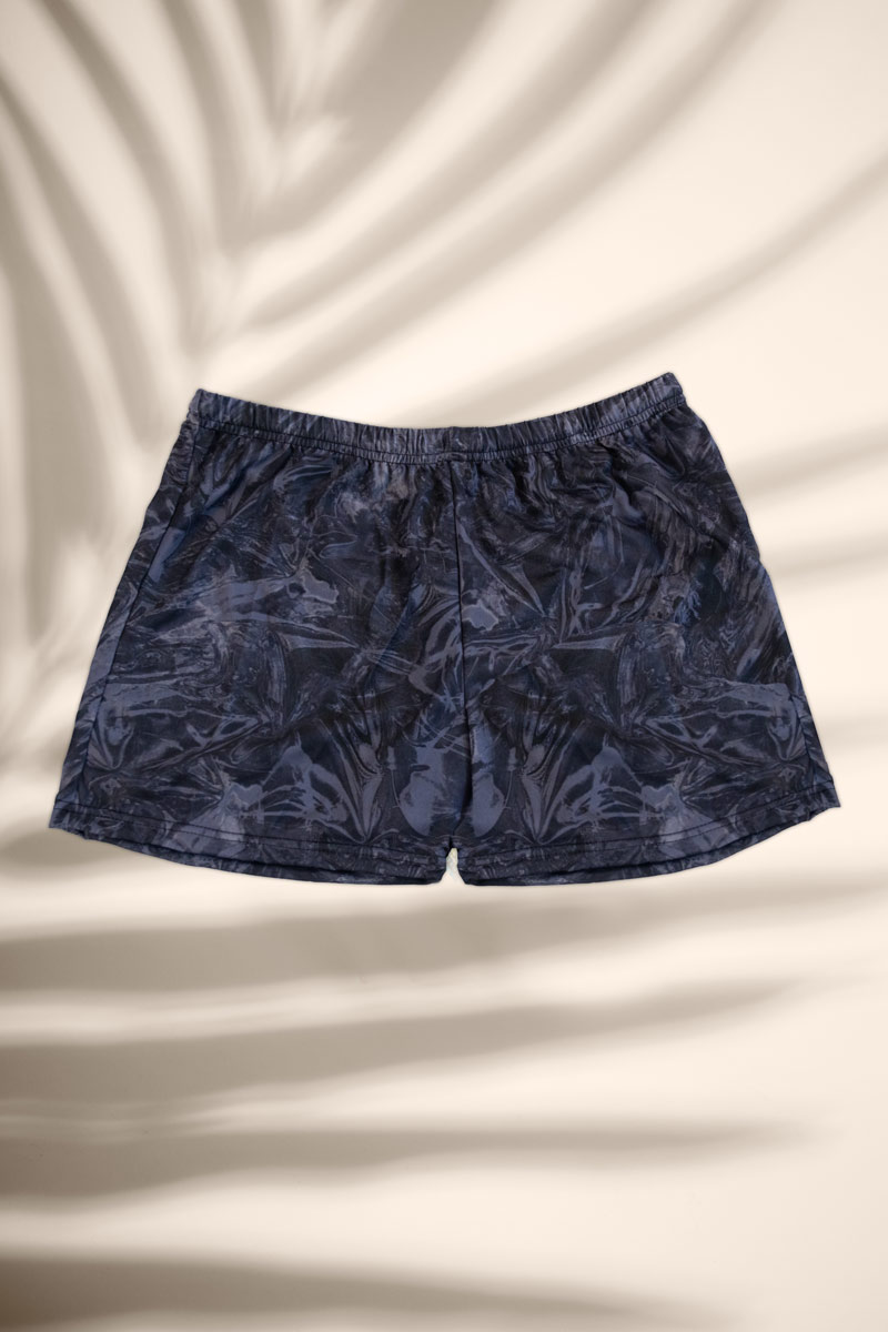 Tan Though purple swim trunks